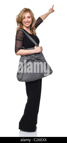 Comité permanent caucasian girl smiling et pointant sur blanc Banque D'Images