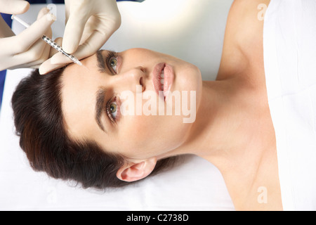 Woman Receiving Botox Injection on Forehead
