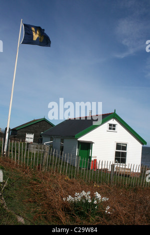 Les maisons en bois sur l'Île Hilbre, Wirral, UK Banque D'Images