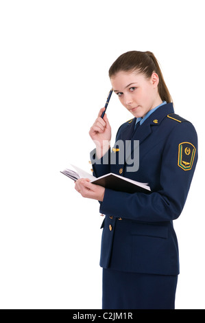 Fille dans l'uniforme de la compagnie ferroviaire avec un journal intime isolé sur fond blanc Banque D'Images