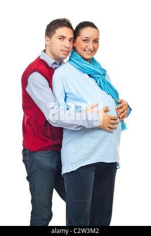 Man embracing pregnant et tenir la main sur son ventre isolé sur fond blanc Banque D'Images