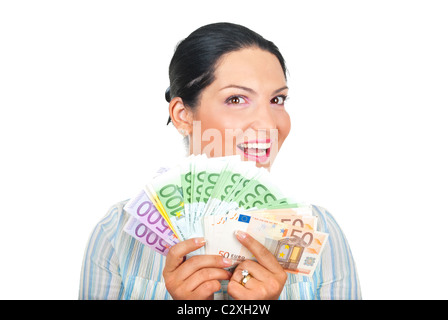 Excitée jeune femme montrant beaucoup d'argent et souriant isolé sur fond blanc Banque D'Images