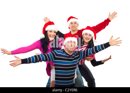 Groupe d'amis heureux de porter des vêtements colorés et Santa hats et debout avec les mains en l'air riant isolated on white Banque D'Images