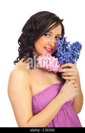 Cute young woman holding bouquet jacinthe isolé sur fond blanc Banque D'Images