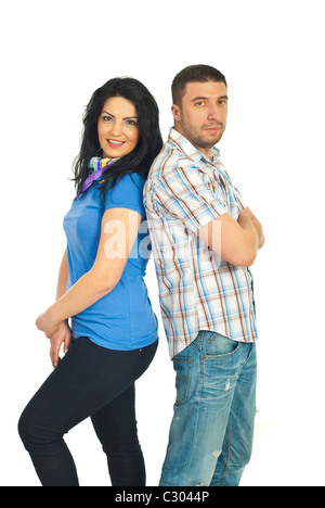 Modèles Casual couple standing back to back over white background Banque D'Images
