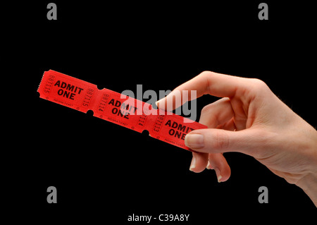 Hand holding red film theatre tickets Banque D'Images