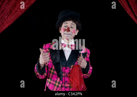 Clown de cirque Waving Arms Banque D'Images