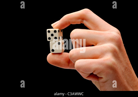 Hand holding dice close up Banque D'Images