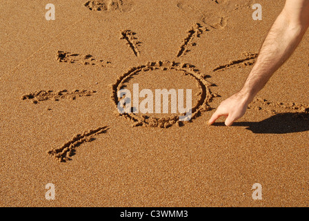 Bien naif en cours d'élaboration dans le sable sur la plage Banque D'Images