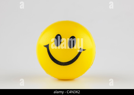 Balle de caoutchouc jaune smiley Banque D'Images