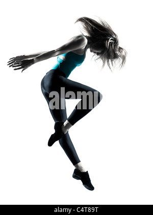 Vue latérale d'un saut souple jeune danseuse sur fond blanc Banque D'Images