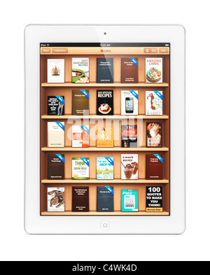 White Apple iPad 2 tablette avec l'iBookstore e-book library sur son afficheur. Isolé sur fond blanc. Banque D'Images