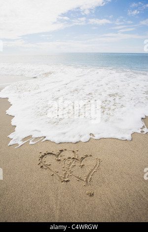 USA, Massachusetts, le coeur dessiné sur une plage de sable Banque D'Images