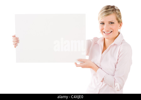 Happy businesswoman tenir de côté en blanc bandeau publicitaire sur white Banque D'Images