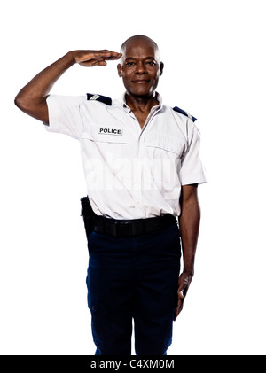 Portrait d'un afro-américain policier saluant en studio sur fond isolé blanc Banque D'Images