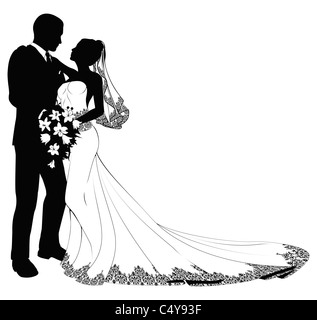 Une mariée et le marié le jour de leur mariage à propos d'embrasser en silhouette Banque D'Images