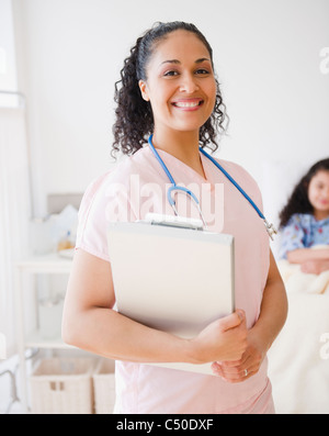 Caucasian nurse in hospital room Banque D'Images