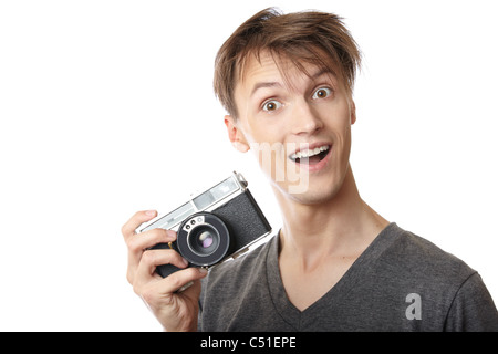 Le jeune photographe holding vintage camera photo film Banque D'Images