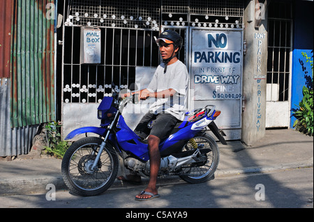 Taxi Motocycle Rider Cebu City aux Philippines Banque D'Images