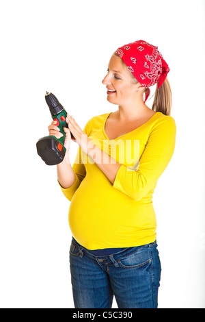 Femme enceinte avec powertools isolated on white Banque D'Images