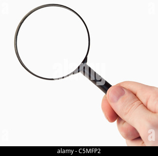 Main tenant une loupe Banque D'Images