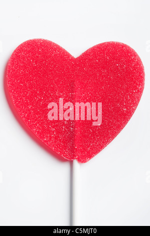 Sucette rouge en forme de coeur, l'amour concept Banque D'Images