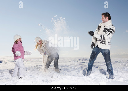 Germany, Bavaria, Munich, Family having snowball fight