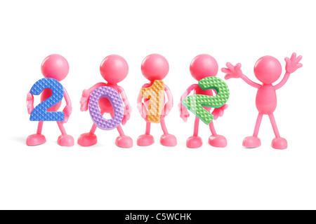 Figurines en caoutchouc sans visage coloré holding année 2012 nombre de blocs sur fond blanc Banque D'Images