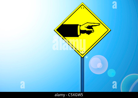 Forme main jaune sur road sign Banque D'Images