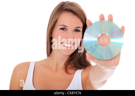 Attractive young woman holding dvd. Le tout sur fond blanc. Banque D'Images