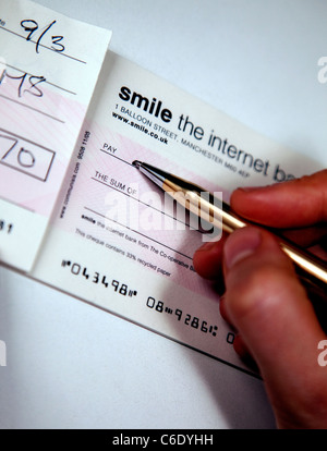 Écrire un chèque, Londres Banque D'Images