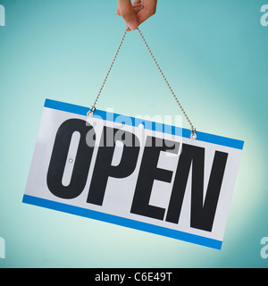 Close up of hand holding open sign Banque D'Images