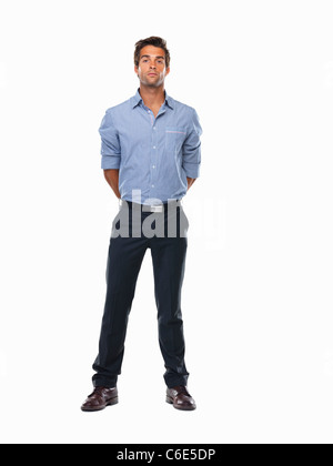 Studio shot of man standing with hands behind back Banque D'Images
