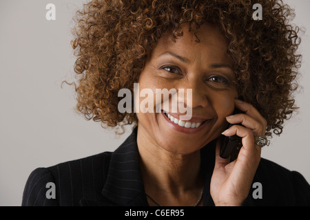 Portrait of mature businesswoman, studio shot Banque D'Images