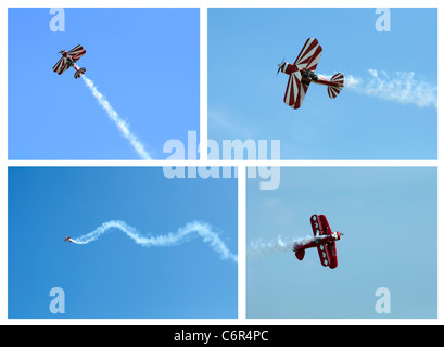 Avion Rouge en boucle dans un ciel bleu. Lot de quatre images Banque D'Images