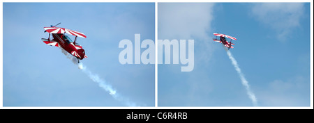 Avion Rouge en boucle dans un ciel bleu Banque D'Images