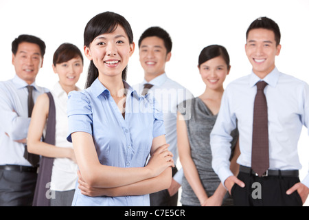 Businesswoman standing in front of Collègues Banque D'Images