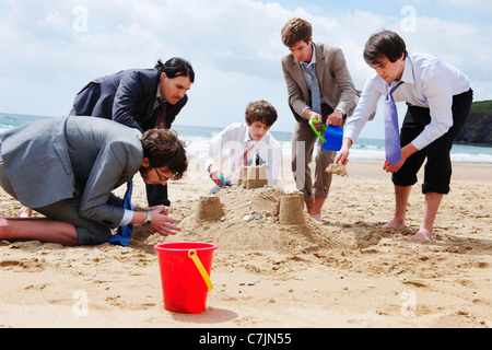 Château de sable de construction d'affaires Banque D'Images