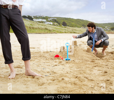 Château de sable de construction d'affaires Banque D'Images