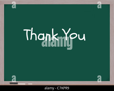 Merci sur un tableau écrit en blanc de craie avec une gomme et craie sur le bas de l'armature en bois. Banque D'Images