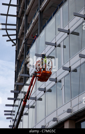 En Construction  La construction des murs de verre de la nouvelle coopérative siège du groupe, l'un Ange Square dans le grand centre-ville de Manchester, Royaume-Uni Banque D'Images