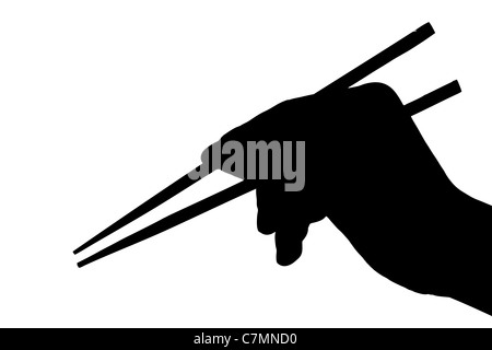 Silhouette of a hand holding chopsticks Banque D'Images