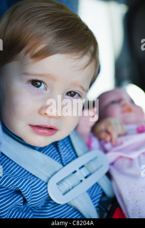 Close up of young boy in car seat Banque D'Images