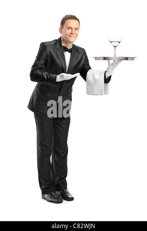 Portrait d'un garçon tenant un plateau avec un verre de cocktail sur elle Banque D'Images