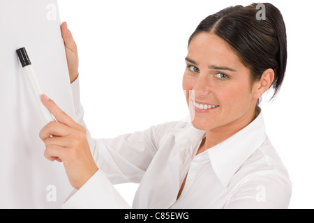 Happy businesswoman pointing at vide tableau on white Banque D'Images