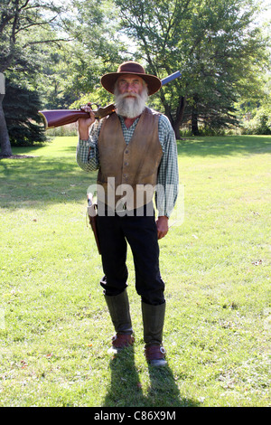 Un cowboy avec un fusil Banque D'Images