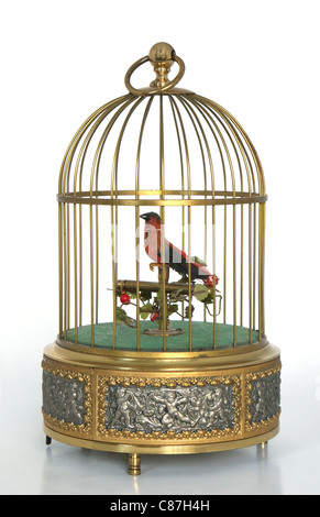 Oiseau rouge musical dans une cage en métal doré d'Allemagne Banque D'Images