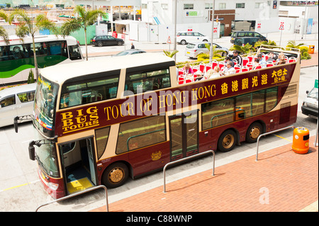 Le Big Bus Tours ouvrir en tête Double Decker Bus touristique faisant une visite de Hong Kong Chine Asie Banque D'Images