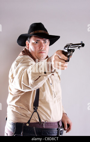 Un cowboy braquer une arme Banque D'Images