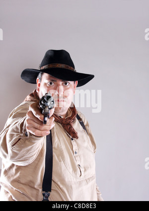 Un cowboy braquer une arme Banque D'Images